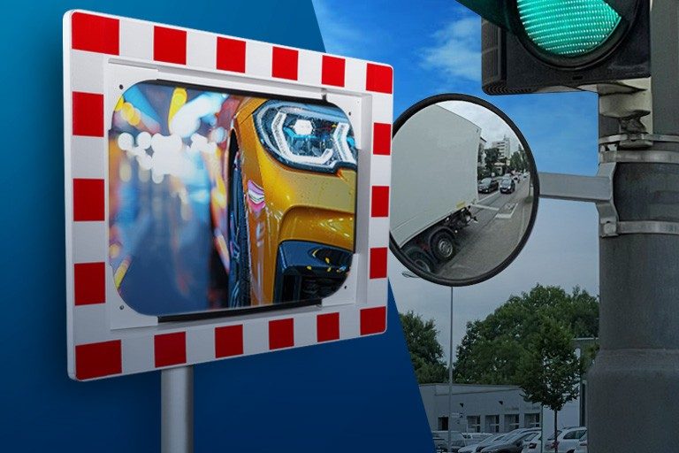Verkehrsspiegel mit rot-weißem Rand und Ampel-Spiegel auf blauem Grund.