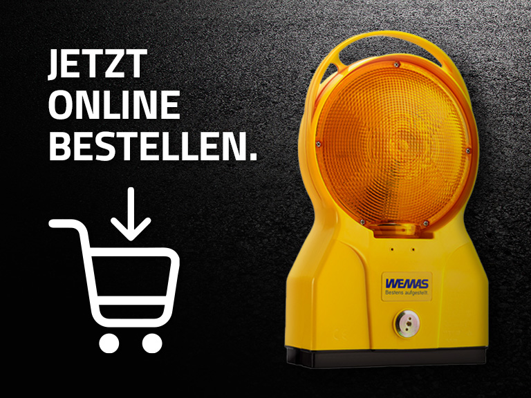 Gelbe Warnleuchte mit großer runder Linse, daneben der Text ‚Jetzt online bestellen.‘ und ein Einkaufswagen-Symbol