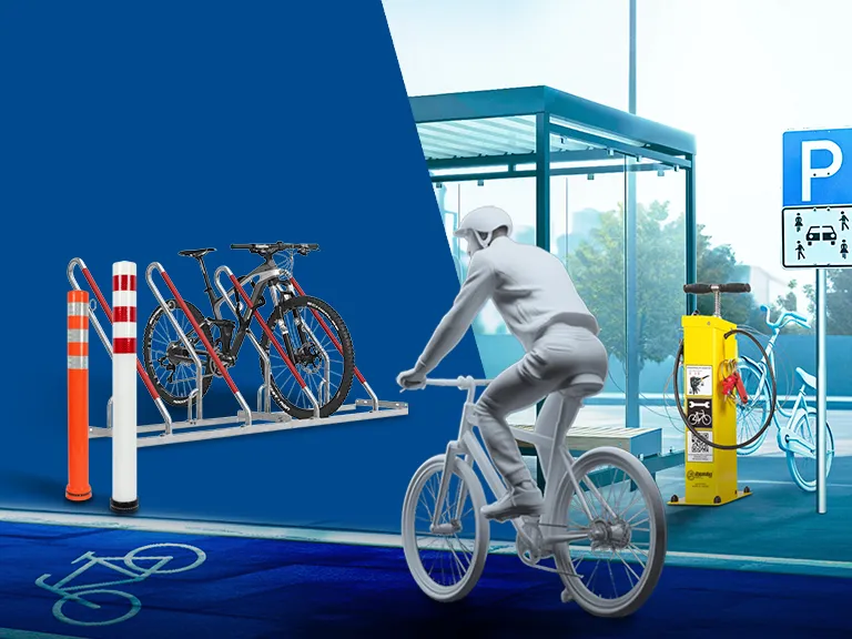 Fahrradständer mit mehreren Fahrrädern sowie Poller und Fahrrad-Reperatur-Station Ibombo neben Radweg